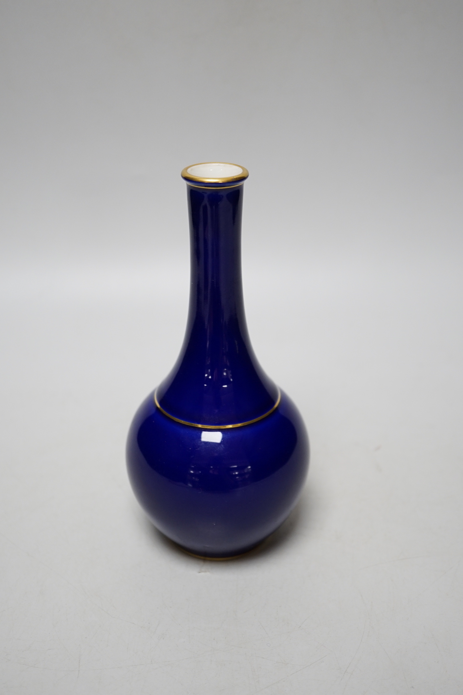 A Sevres blue glazed bottle vase, date code for 1924, 17cm
